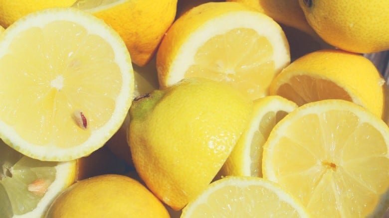 A close up shot of a pile of sliced lemons