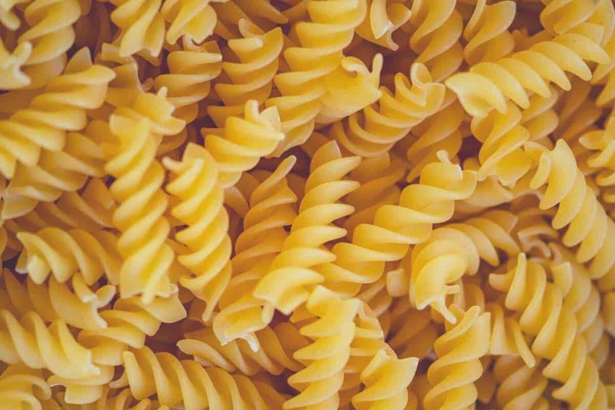 A pile of fusilli pasta, ready to go in the microwave