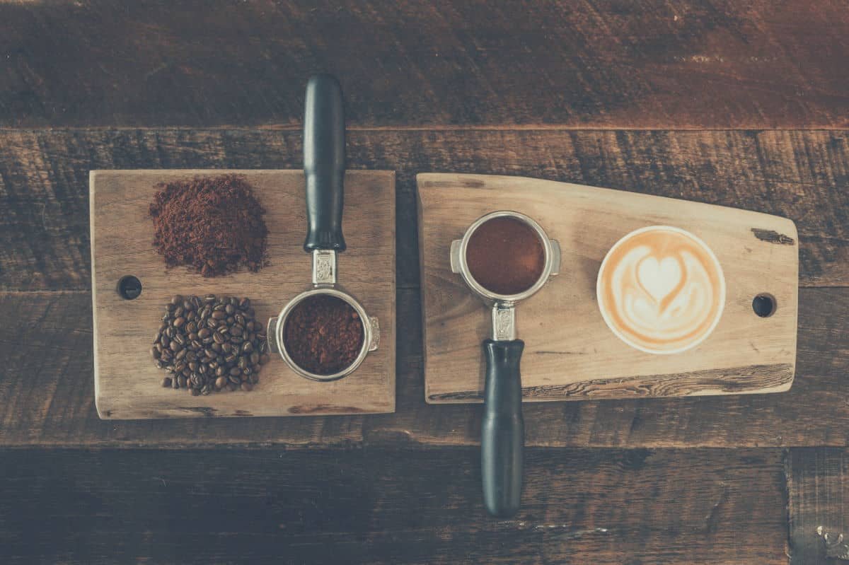Birds eye view of espresso tampers on a serving board