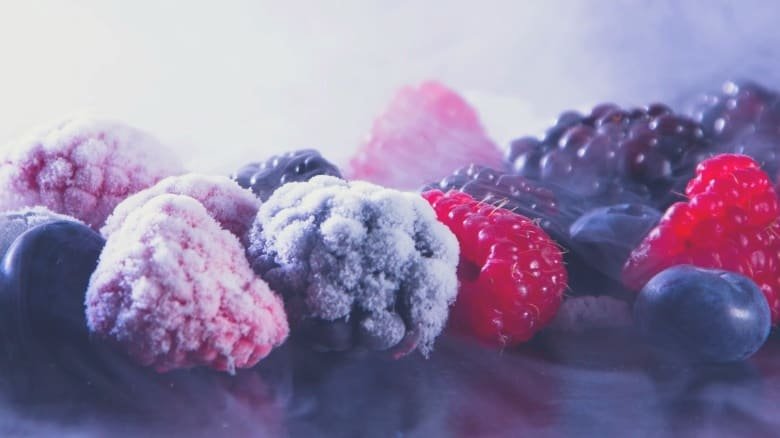 a close up of frozen berries