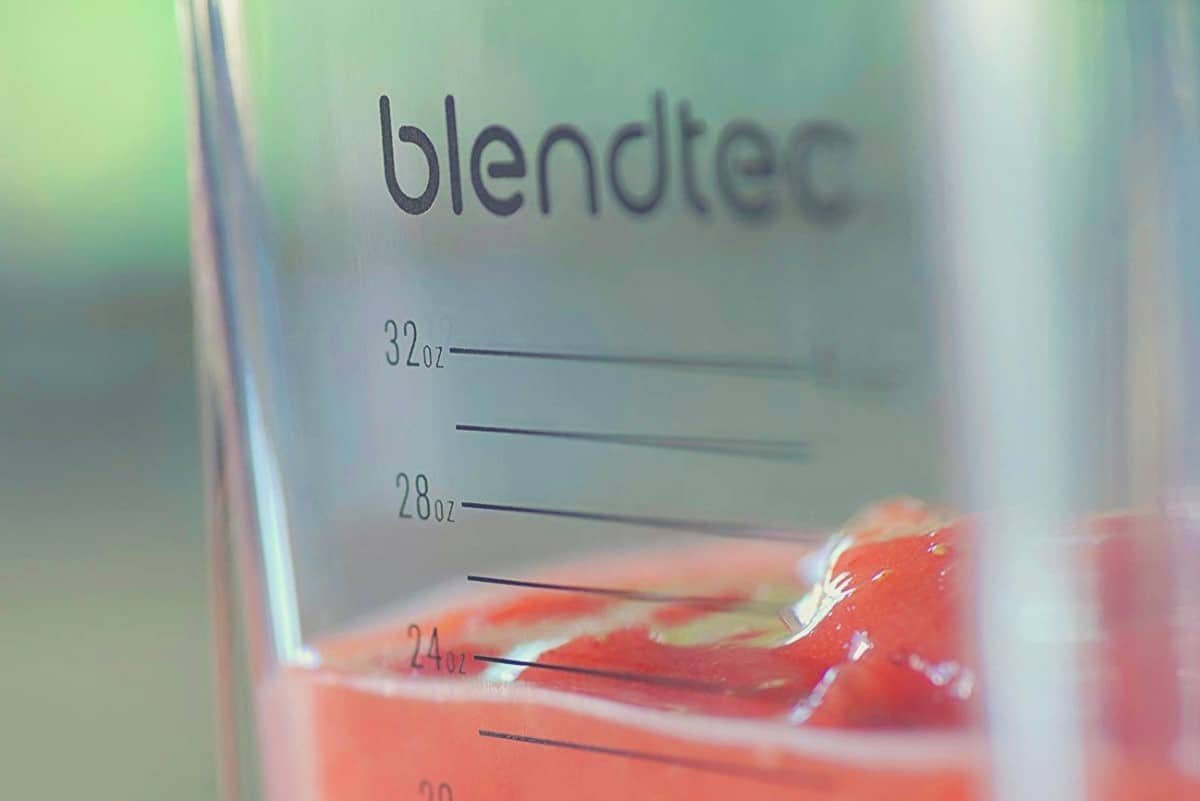 A close up of the blendtec classic container jar with strawberries inside