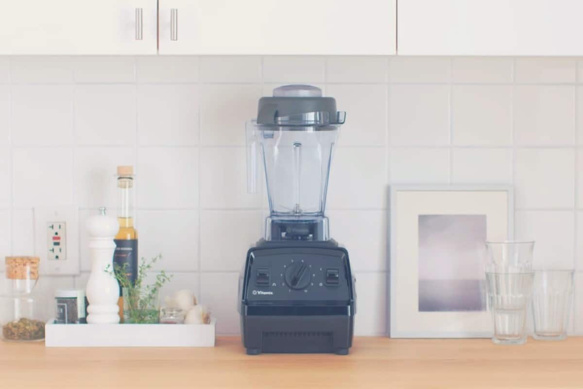 A Vitamix Explorian E310 blender on a kitchen countertop
