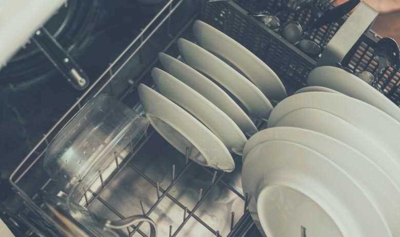 A top down view of plates sitting in a dishwasher