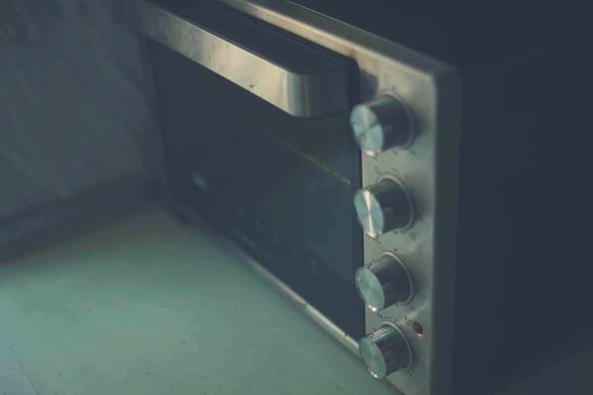 An old microwave oven combo on a work surface