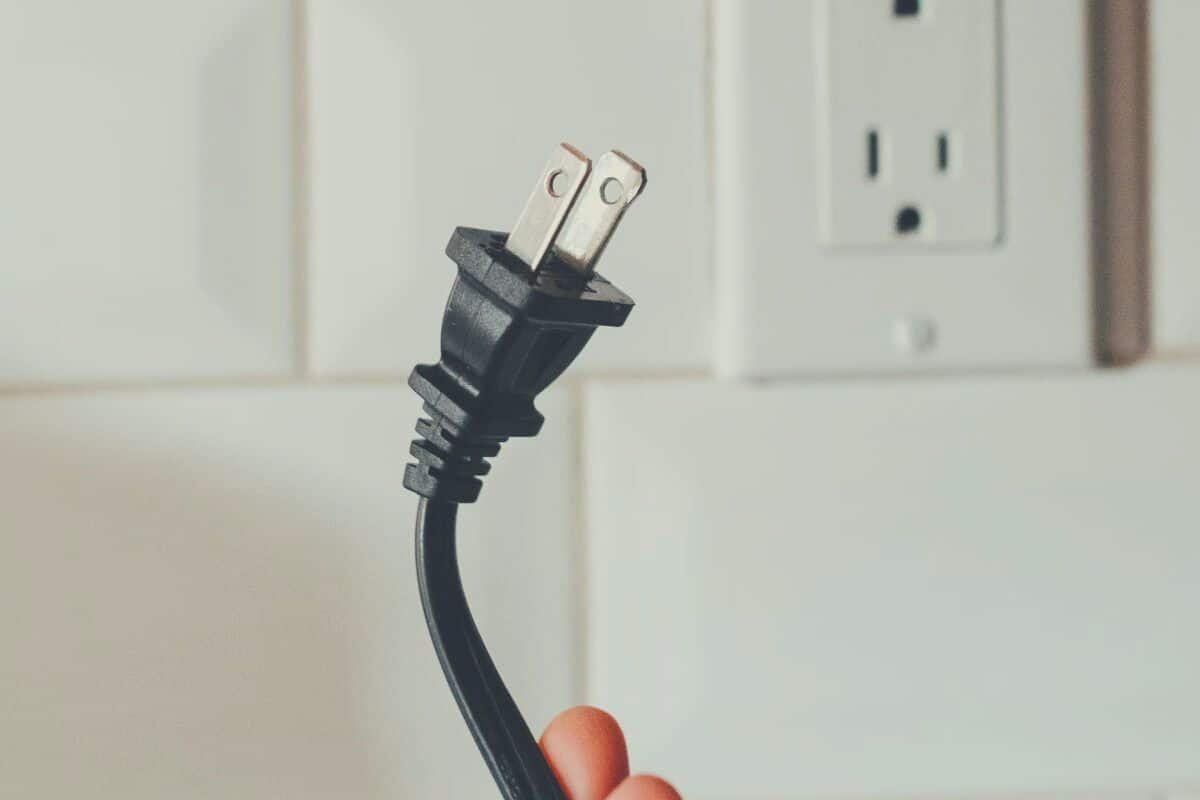 A kitchen appliance power cord and plug, removed from the power socket