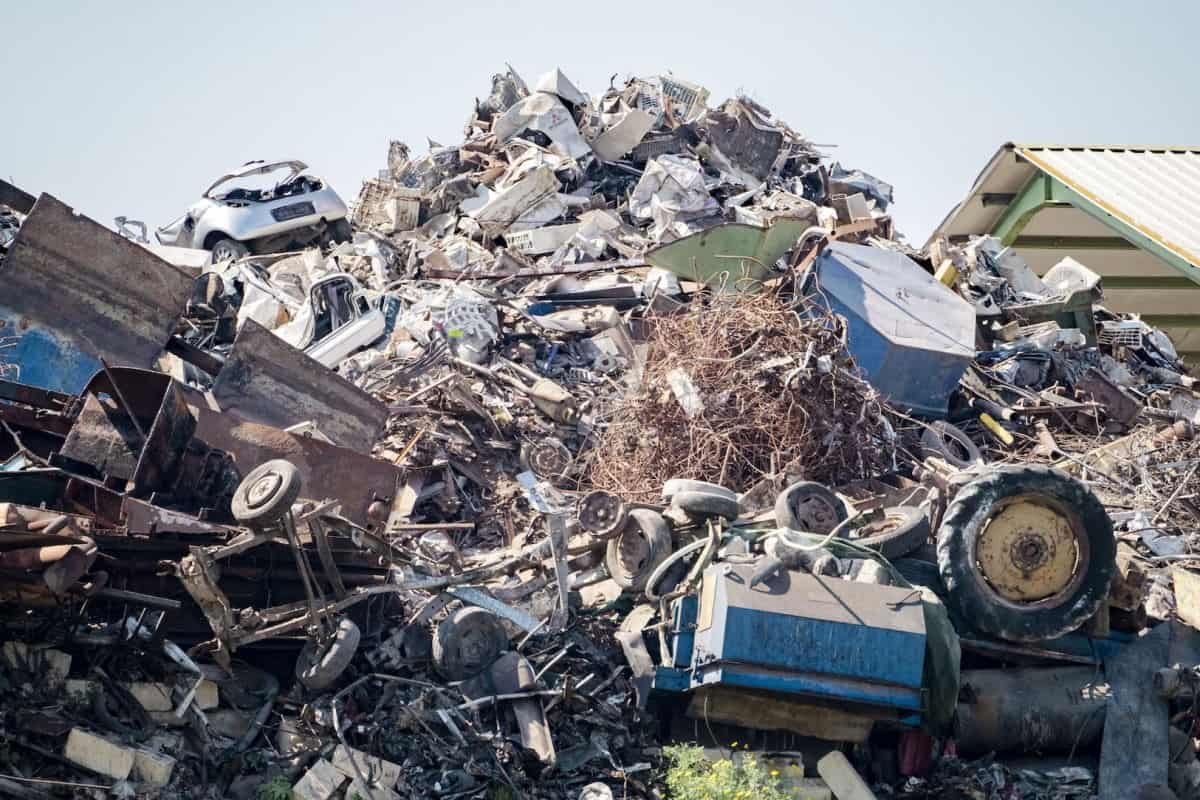 A pile of wreckage at a landfill recycling center.