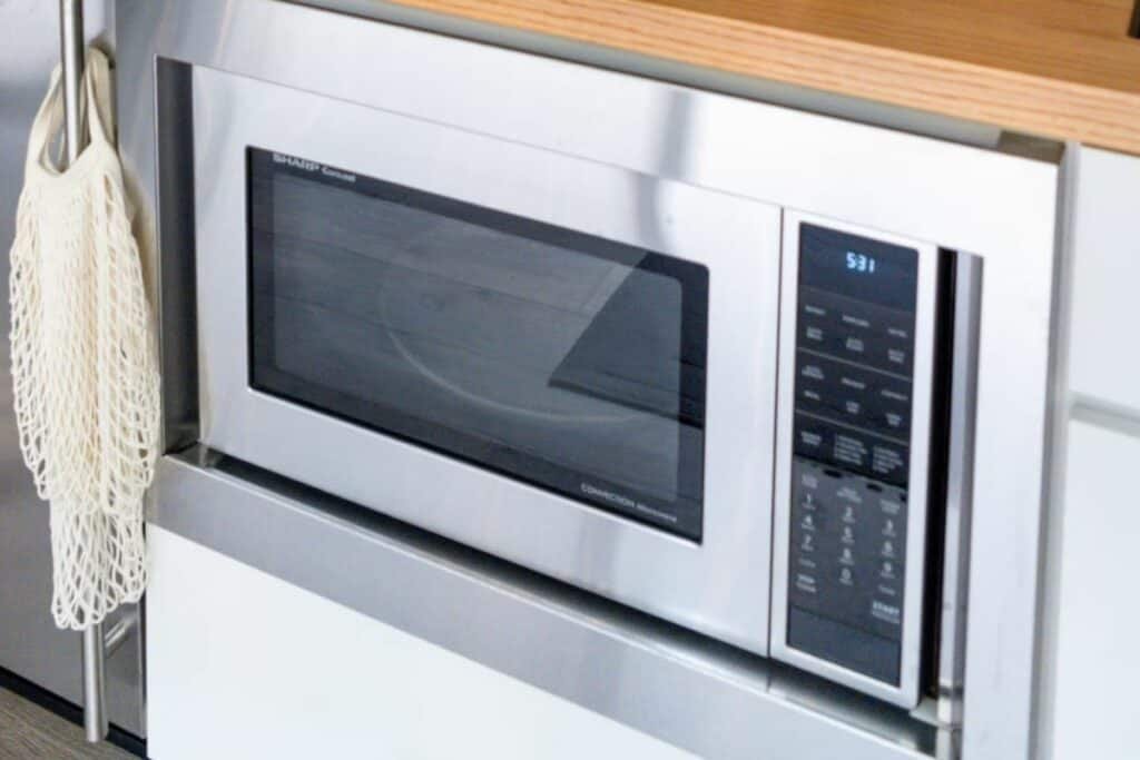 A close up shot of an under-counter microwave